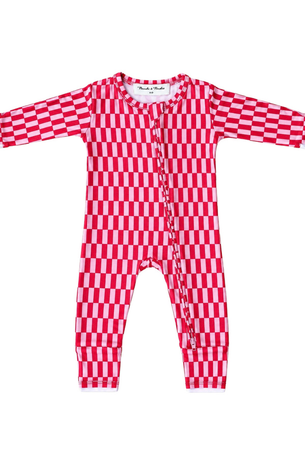 A baby long-sleeve footless one-piece jumpsuit with a red and white checkerboard pattern, featuring a snap-button front closure and white trim.