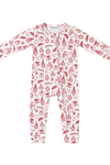 A baby long-sleeve footless one-piece jumpsuit in white with a red Christmas-themed all-over print, laid flat on a white background.